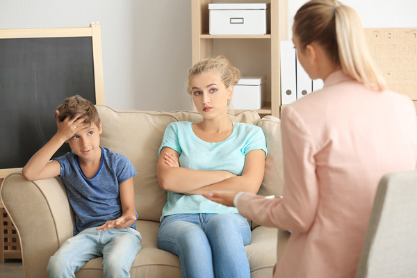 Young child psychologist working with family in office Young child psychologist working with family in office